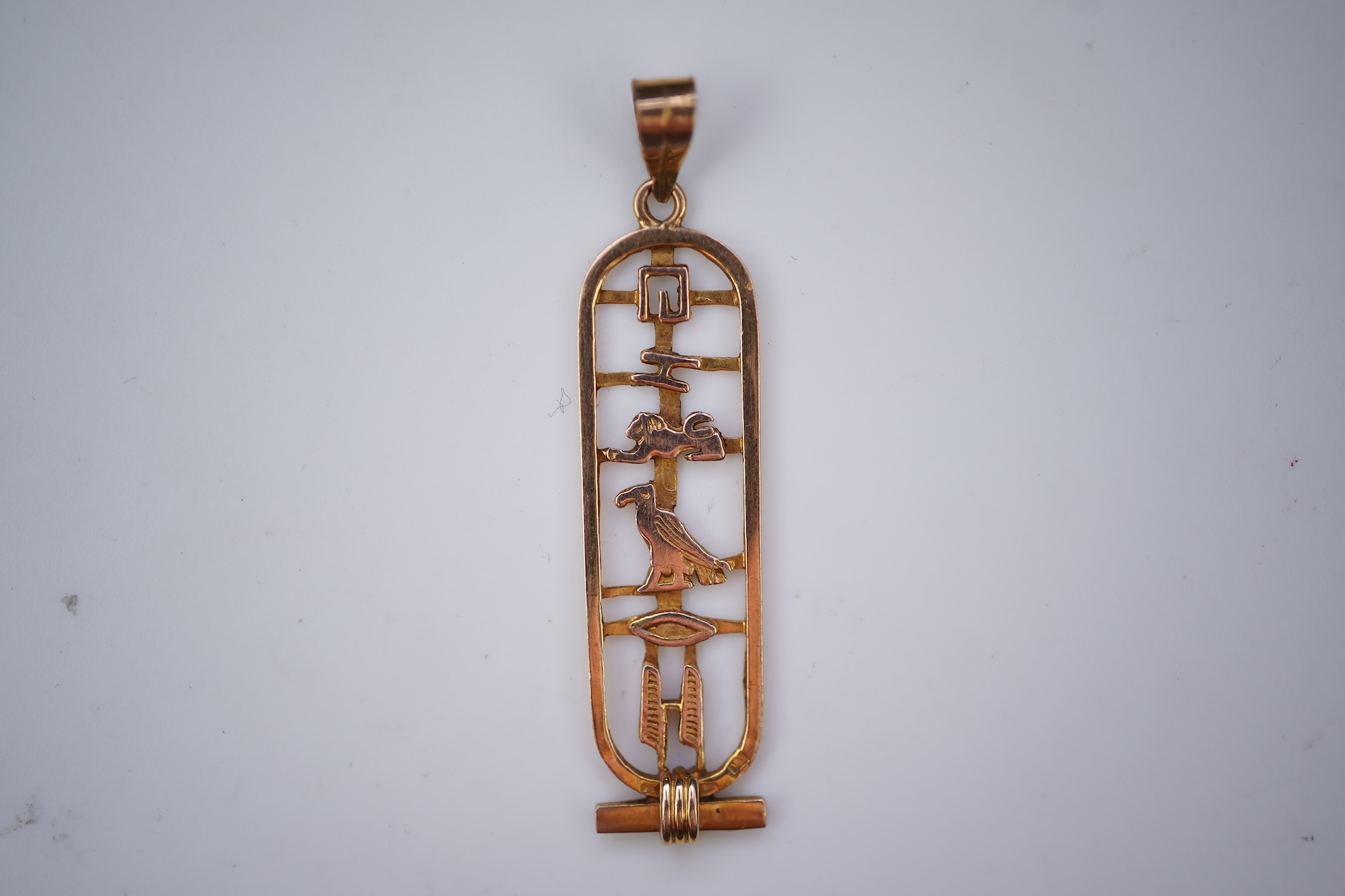 Two gold pendants